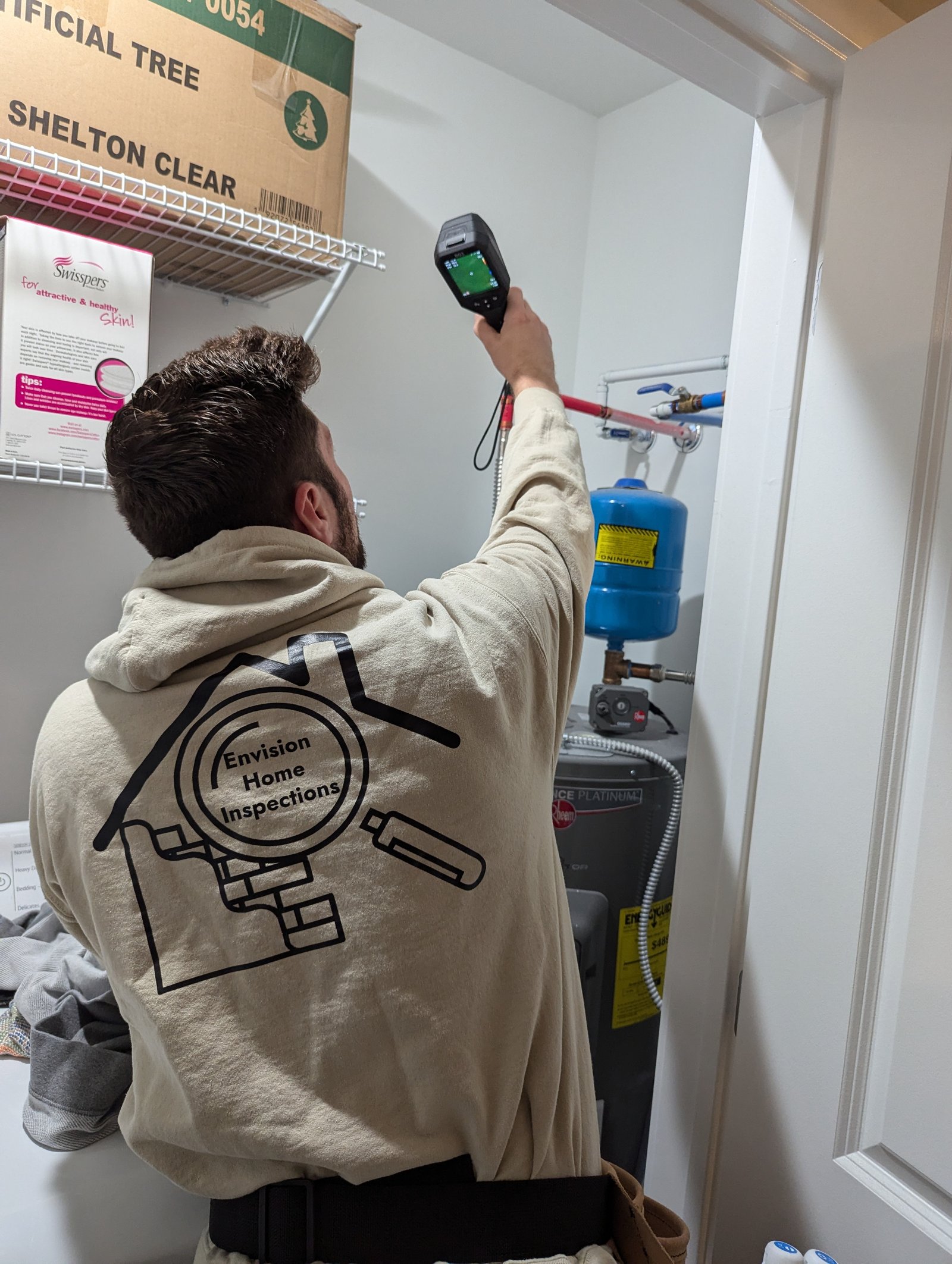 Nico Bianco using thermal imaging equipment during a home inspection